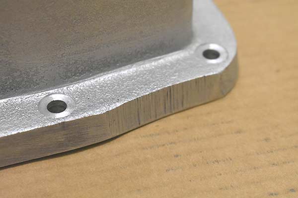 Small bits of the flange are missing.