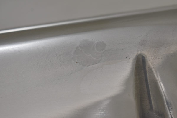 A dark spot on exhaust side of second valve cover.