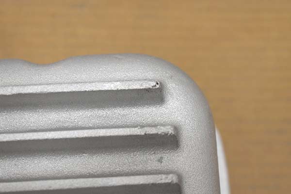 Some jagged surfaces on the fins of transmission pan.