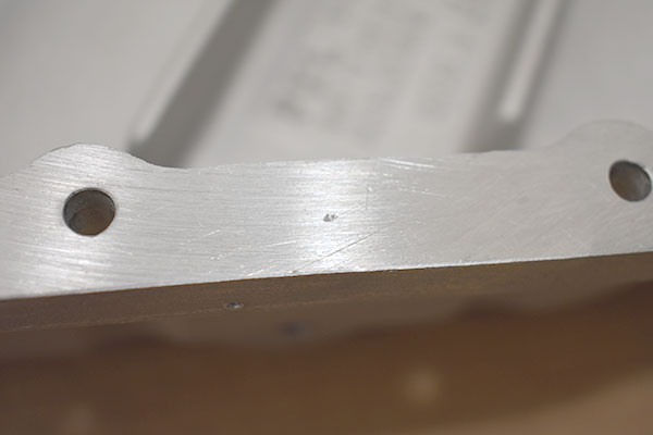 A small pit on flange of transmission pan.