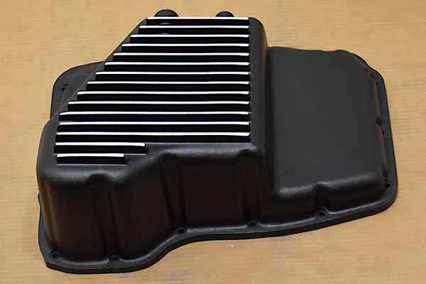 Outside of transmission pan.