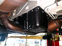 Passenger side view of PML transmission pan on 2015 Chevy 2500HD