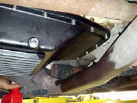 Looking up at PML transmission pan on a 2011 F150