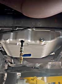 Filling PML pan with transmission fluid