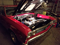 Working on engine in a 1967 Chevelle